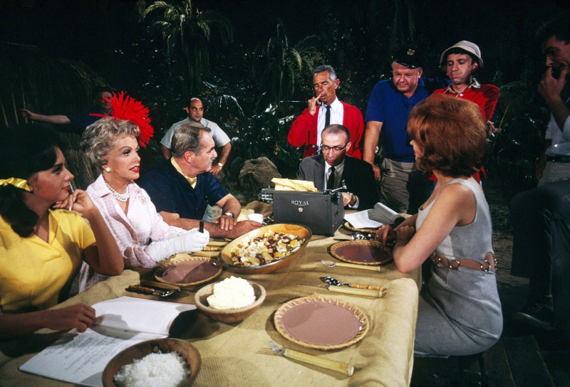  GILLIGAN'S ISLAND, at table, from left: Dawn Wells, Jim Backus, Natalie Schafer, writer and producer Sherwood Schwartz, Tina Louise, standing in blue: Alan Hale Jr., Bob Denver (white hat), 1964-1967. ph: Ivan Nagy 